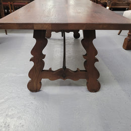 Spanish style French Oak farmhouse table with ironwork underneath. It is in good original detailed condition and has been sourced from France.