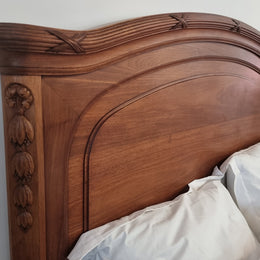 Fabulous French Walnut queen size bed with lovely detail and comes with custom made slates. It is in good original detailed condition.