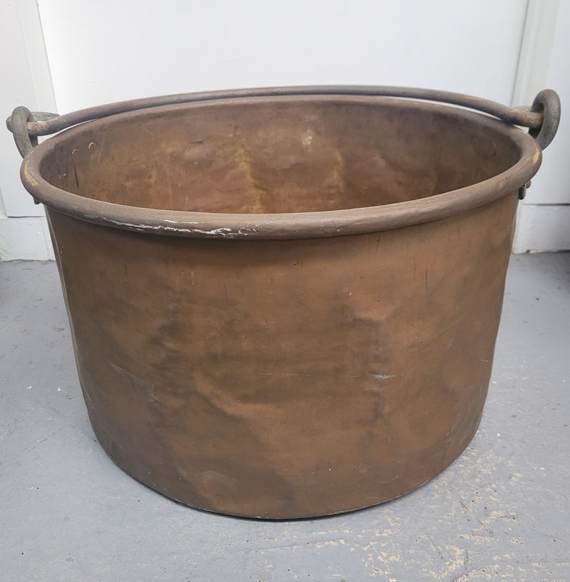 Large Antique French copper pot with wrought iron handle. It is in good original condition.