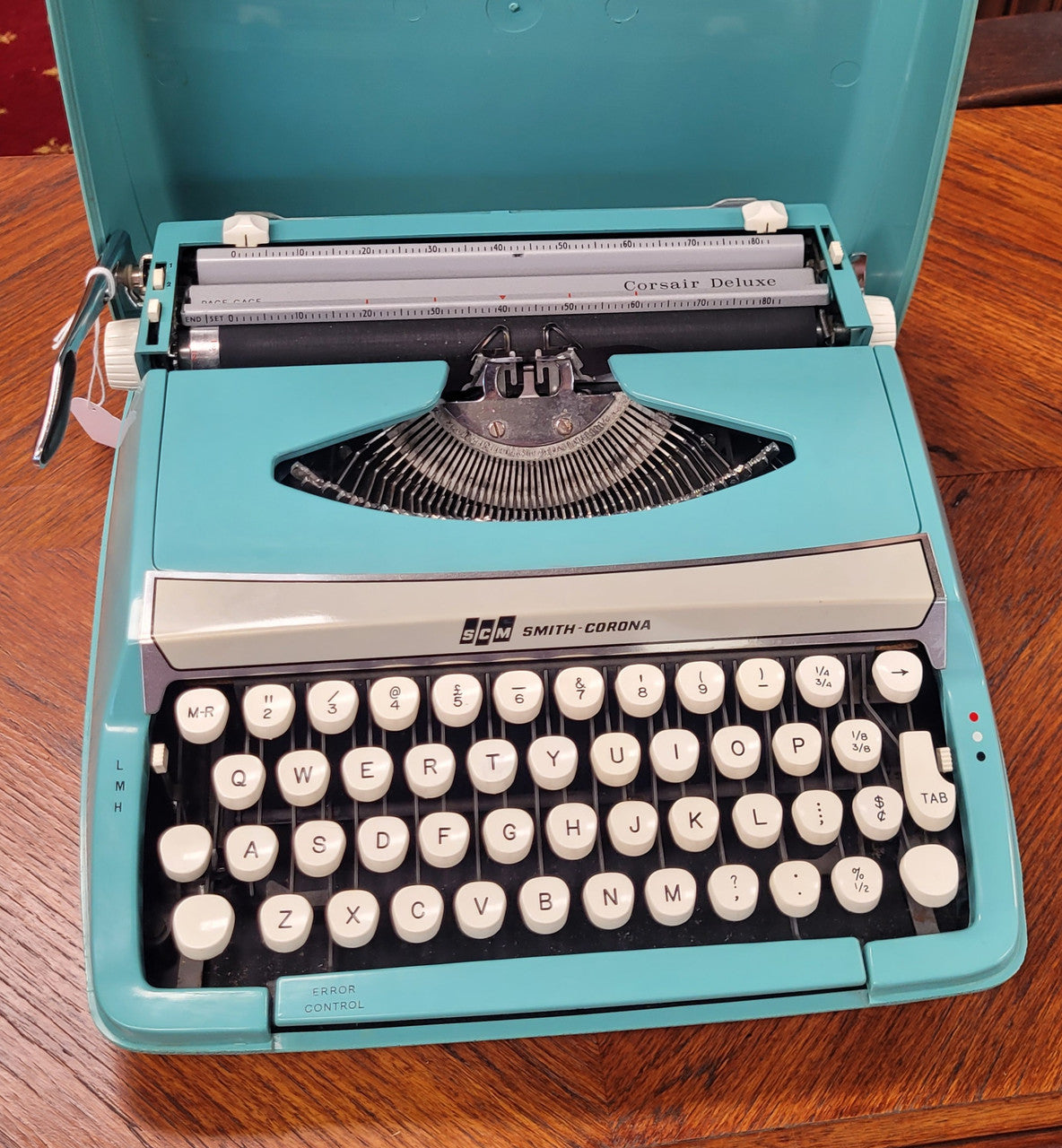 1960's Smith Corona Corsair deluxe portable typewriter. It is in working condition with a used ribbon, and comes with everything pictured. It has been sourced locally.