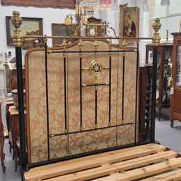 Rare Antique cast iron and brass Victorian queen size bed. Comes with custom made slats.  It has been sourced locally and is in good original condition.