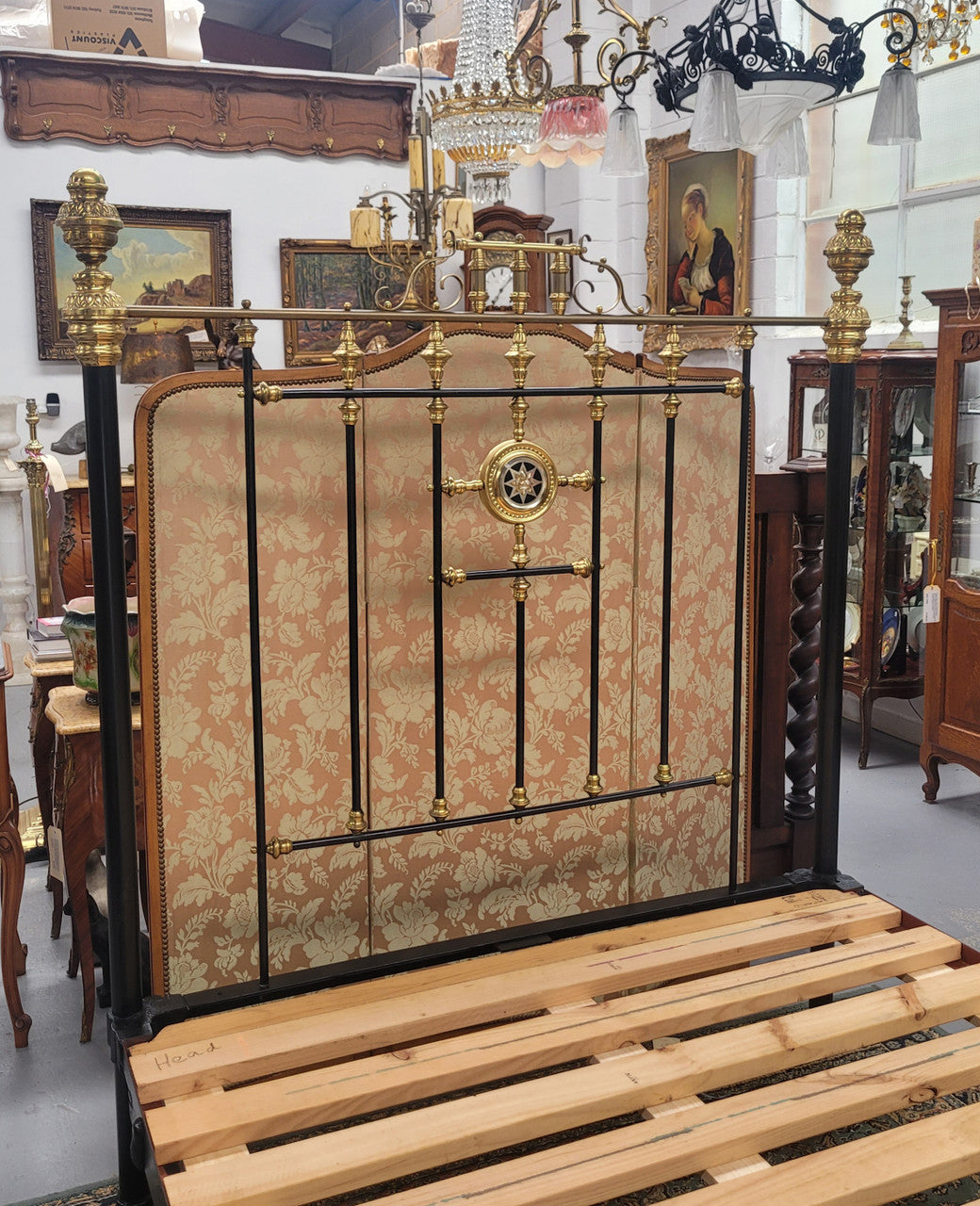 Rare Antique cast iron and brass Victorian queen size bed. Comes with custom made slats.  It has been sourced locally and is in good original condition.