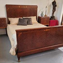 French Art Deco bedroom suite consisting of queen size bed in Amboyna wood and featuring pretty inlay. It comes with a matching pair of bedsides. It is a very stylish and high quality suite. It has been sourced from France and is in good original detailed condition.