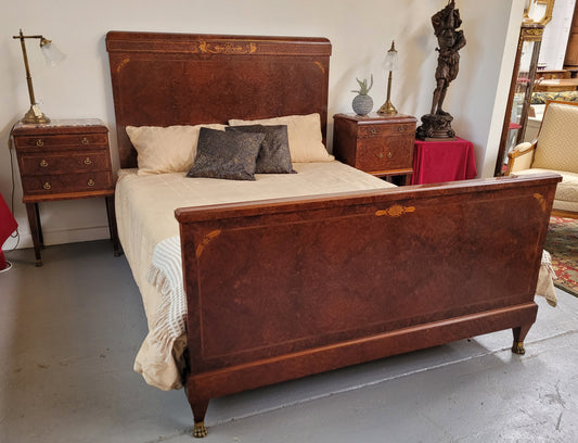 French Art Deco bedroom suite consisting of queen size bed in Amboyna wood and featuring pretty inlay. It comes with a matching pair of bedsides. It is a very stylish and high quality suite. It has been sourced from France and is in good original detailed condition.