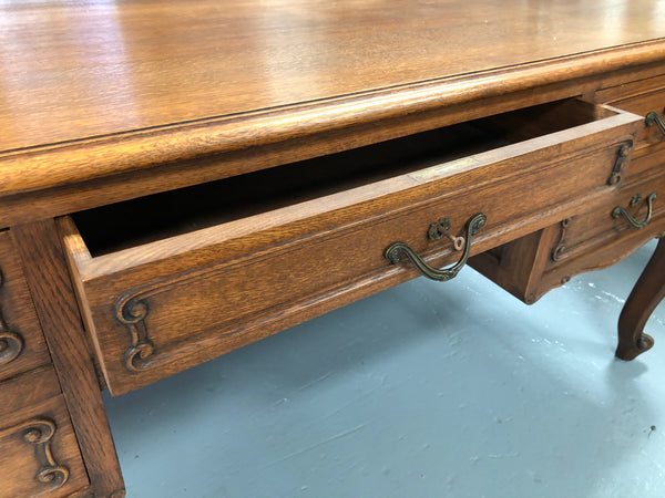 French Oak Louis XV style full partners desk with both sides having five functional drawers. In very good original detailed condition.