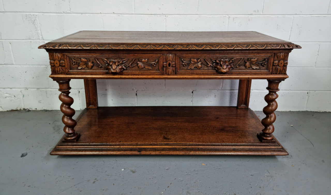 Antique French Oak Henry II style two drawer cabinet which would make an ideal TV cabinet or music unit. In good original detailed condition.