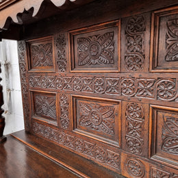 Impressively carved 18th Century English Oak kitchen dresser in 17th Century Jacobean style. It is in good original detailed condition and has been sourced from France.