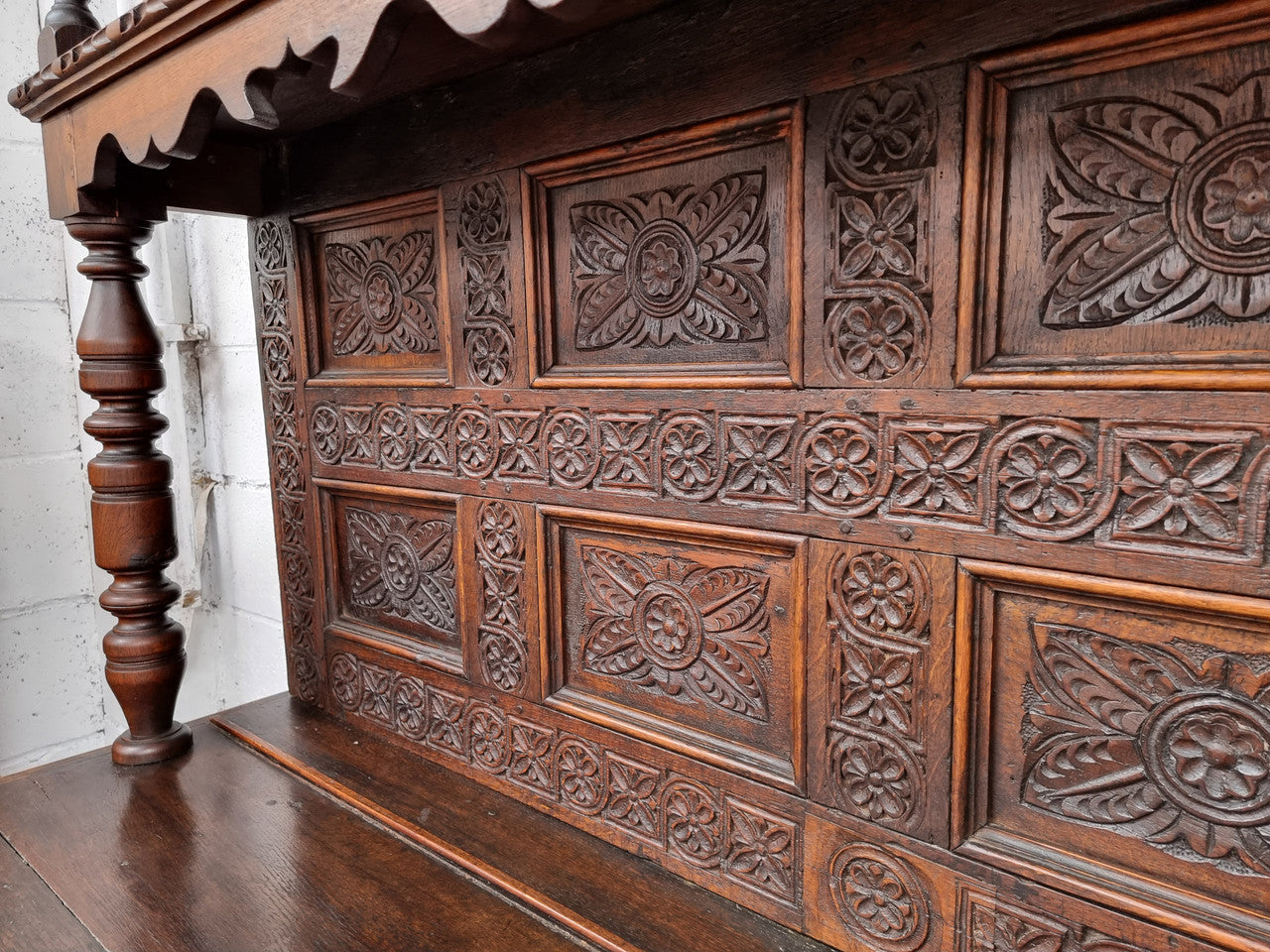 Impressively carved 18th Century English Oak kitchen dresser in 17th Century Jacobean style. It is in good original detailed condition and has been sourced from France.