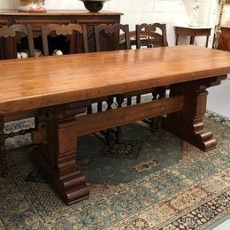 French Farmhouse table with a beautiful thick plank top and stretcher base. Can seat 8-10 people comfortably and is in good original detailed condition.
