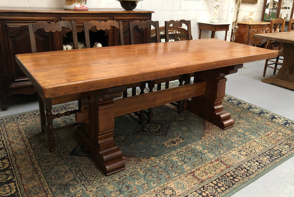 French Farmhouse table with a beautiful thick plank top and stretcher base. Can seat 8-10 people comfortably and is in good original detailed condition.