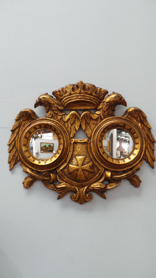 A unique and beautiful hand carved French gilt wood double mirror. It is 47 cm tall and 58 cm wide. From circa 1930 and in excellent restored condition.