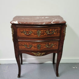 A stunning French petite two drawer inlaid Rosewood commode. In good original detailed condition.