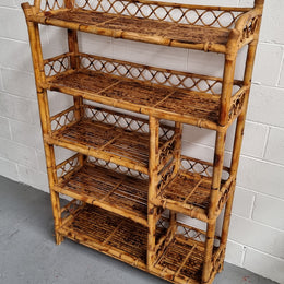 Vintage Tortoiseshell Bamboo Shelves.  Good size unit with irregular shelves. It is in good original condition and it very solid.