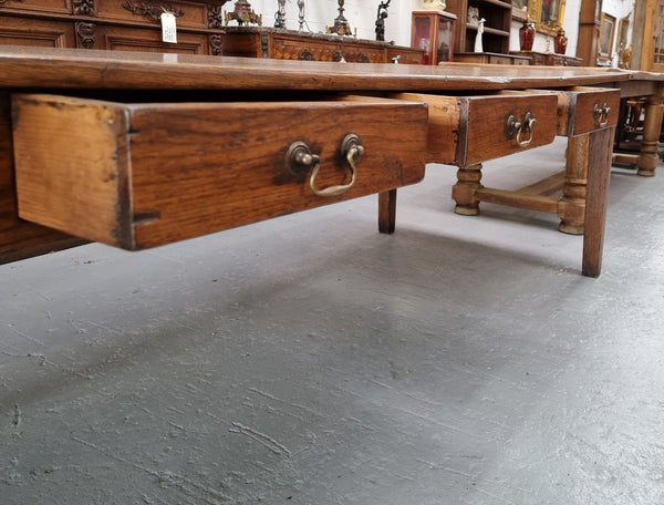 Amazing 19th Century French Oak Farmhouse Style Dining Table with three drawers. It is made from 3 large planks of wood which is very hard to find. 105.5 cm wide.
