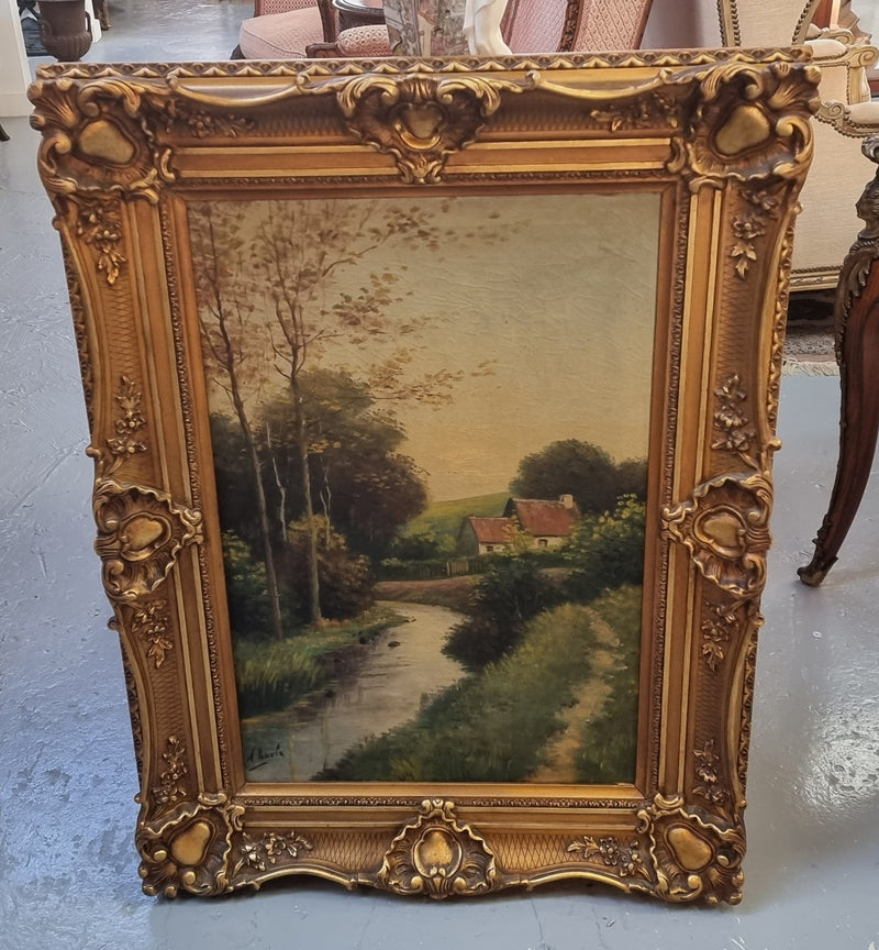 Lovely signed landscape river scene oil on canvas framed in a beautiful ornate frame and in good original condition.