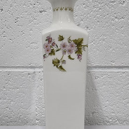 Lovely floral Wedgwood white vase with a pretty design in good condition, please view photos as they help form part of the description.