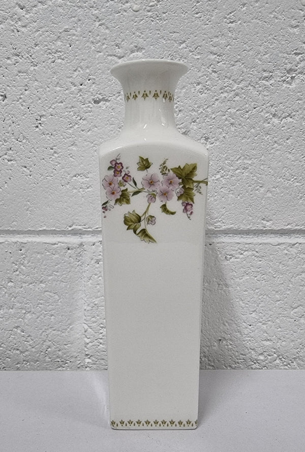 Lovely floral Wedgwood white vase with a pretty design in good condition, please view photos as they help form part of the description.