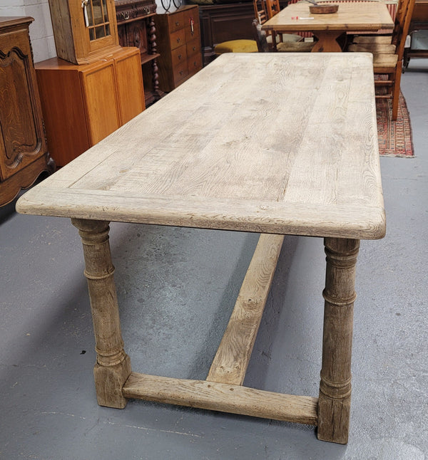 Beautilful raw solid oak French pedestal extension table. It has been sourced from France and is in good original detailed condition. When the table is fully extended it is 339 cm long and can comfortable seat 10-12 people. Features raw wood that could be used as is for a distressed look, or finished and waxed for a more refined look.