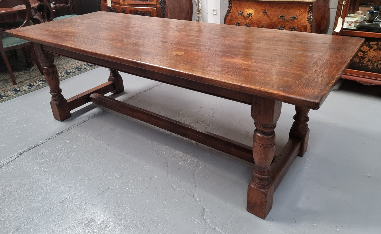 Vintage French Oak stretcher base farmhouse table. It is in good original condition.