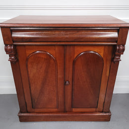 Cedar side cabinet with two doors one drawer and lovely door panels and corbels. It has been sourced locally and is in good original detailed condition.