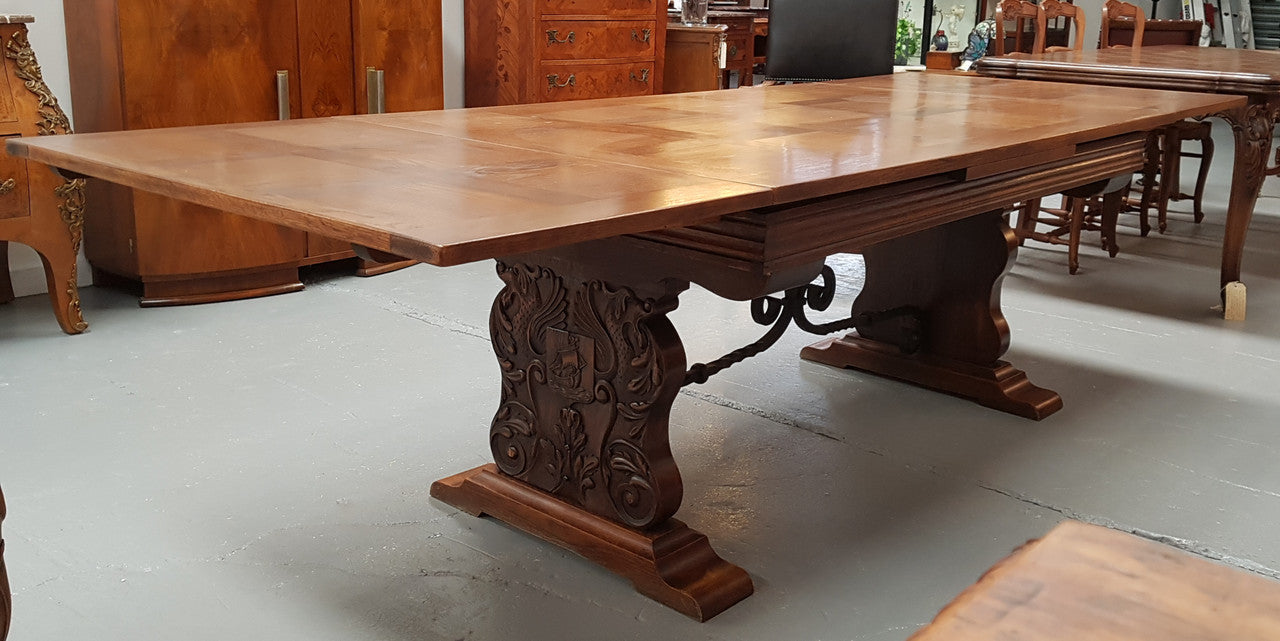 A beautiful French oak, Spanish style parquetry top extension table, with amazing carving and lovely details in very good condition.