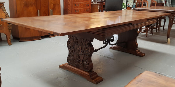A beautiful French oak, Spanish style parquetry top extension table, with amazing carving and lovely details in very good condition.