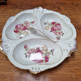 Vintage ceramic three sectional floral bowl with handle and gilt rim. Stamped underneath and in good original condition with no chips or cracks. Please view photos as they help form part of the description.