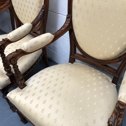Beautiful pair of Vintage French Walnut Louis XVI style carved Fauteuils with lovely upholstery and wide seats . In good original detailed condition.