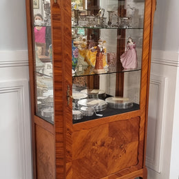 Beautiful French walnut inlaid vitrine with a lovely marquetry design and ormolu mounts. Has a beautiful coloured marble top and two glass shelves. In good original condition.