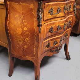 Antique French Louis XV style compact three drawer marble top commode with marquetry inlay and ormolu mounts. Sourced from France and in good original detailed condition.