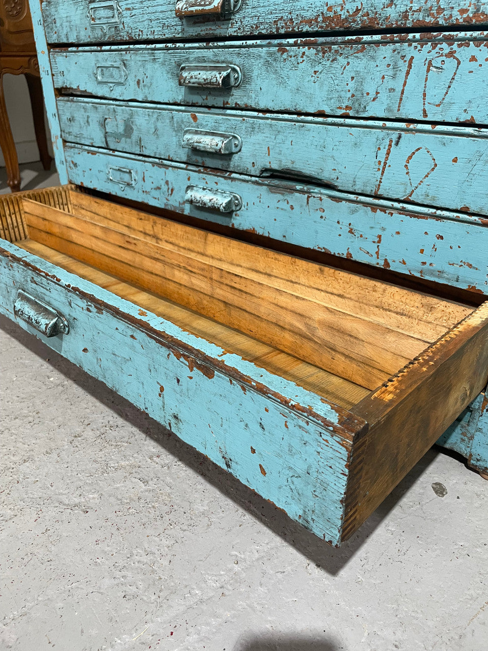 Fabulous set of vintage painted blue printers drawers that have adjustable separators which can be taken out for large papers. The drawers are various sizes and there is a section on top for working on or for storing brushes or tall items . These would be perfect for artists or jewellery pieces or even architects. Such a beautiful piece of industrial furniture.
