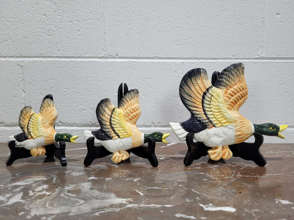 Set of three Vintage wall hanging flying ducks. In good original condition with crazing but no cracks or chips. Please view photos as they help form part of the description.