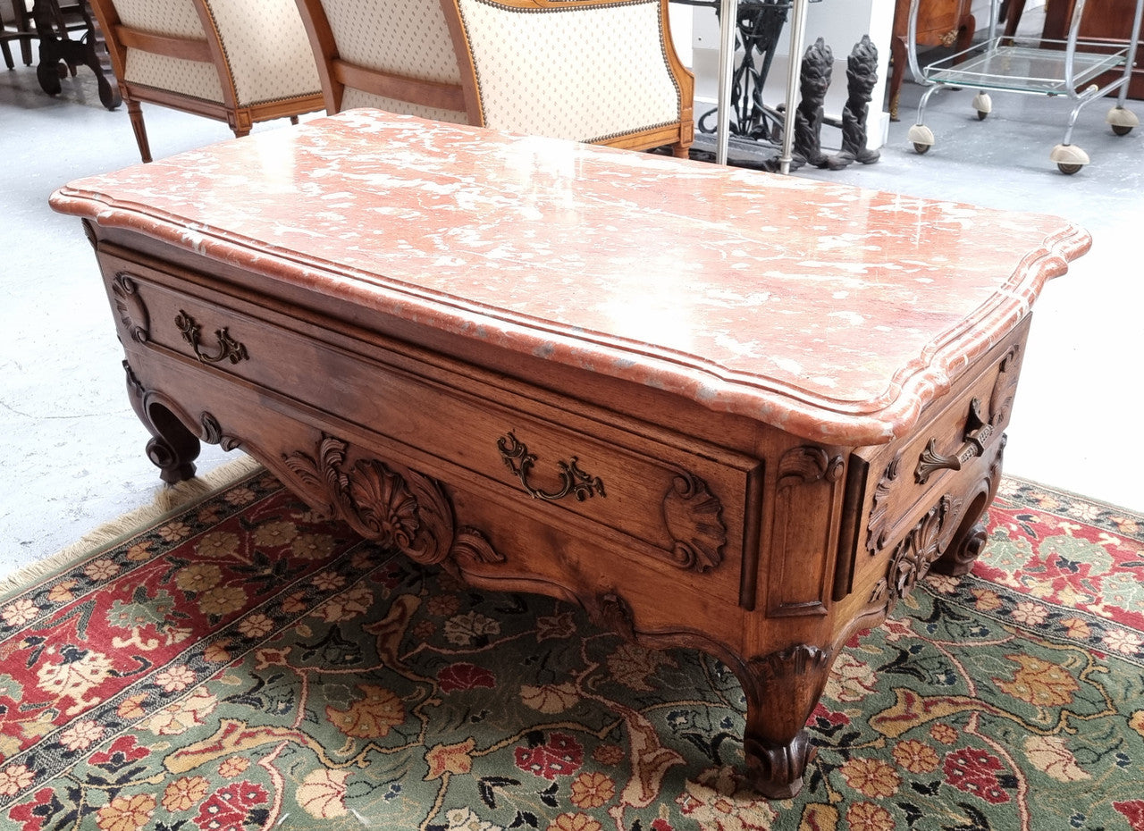 Amazing original walnut Louis XV style coffee table with a marble top, one drawer on either end and a faux drawer at the front. In good original detailed condition, sourced in France.