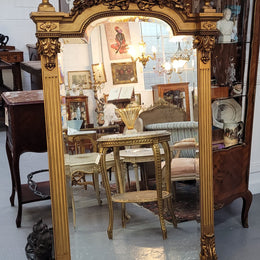 French Louis XVI style Napoleon III (1870’s) gilt mantle mirror. Beautifully carved and decorated with original bevelled mirror showing signs of age. It is in good original detailed condition and has been sourced from France.