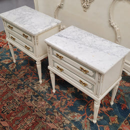 Attractive pair of Vintage French Louis 16th style two drawer marble topped bedsides. They have been sourced from France and are in good original condition.