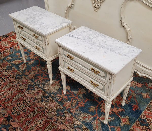 Attractive pair of Vintage French Louis 16th style two drawer marble topped bedsides. They have been sourced from France and are in good original condition.