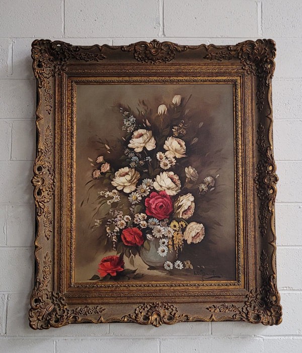 Attractive French floral oil on canvas - signed. Mounted in a stunning patterned gilded frame. It is in good original detailed condition.