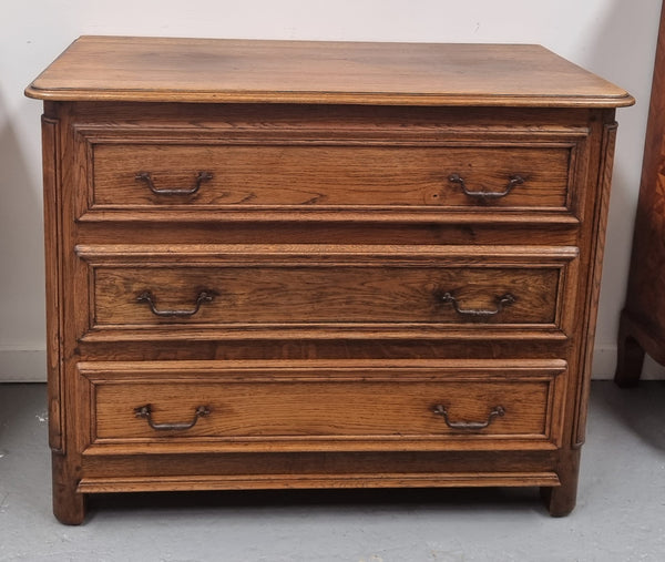 French solid Oak Louis 14th style chest of three drawers. It has three large spacious drawers and it has been sourced from France. It is in good original detailed condition.