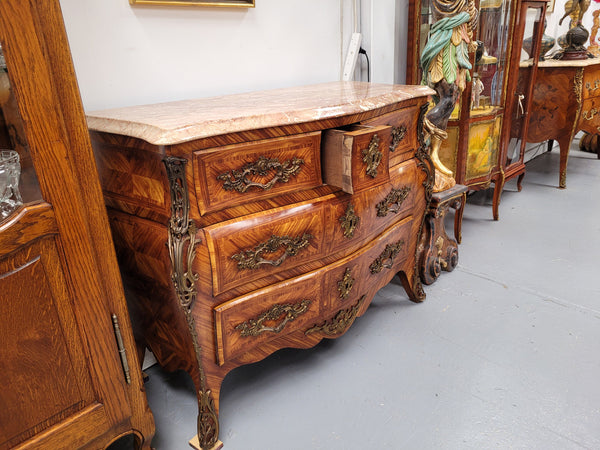 Beautiful French Louis XV style Kingwood inlaid marble top four drawer commode. It has decorative mounts and has been sourced from France. It is in good original detailed condition.