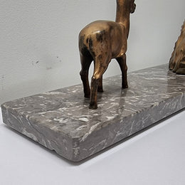 Art Deco gilt metal lady and deer statue on a lovely grey marble base. It has been sourced from France and is in good original condition. The marble does have some minor chips and wear due to age, please view photos as they help form part of the description. Please contact us if you would like additional photos.