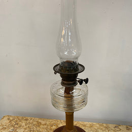 Edwardian ribbed glass kero lamp on a turned wooden base. Circa 1900's.