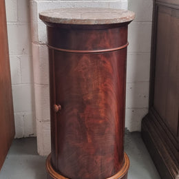 Unusual Empire flame Mahogany cylindrical marble topped bedside/pedestal. Would make an ideal pedestal with added storage inside or could be used as a bedside. Sourced from France and is in good original detailed condition.