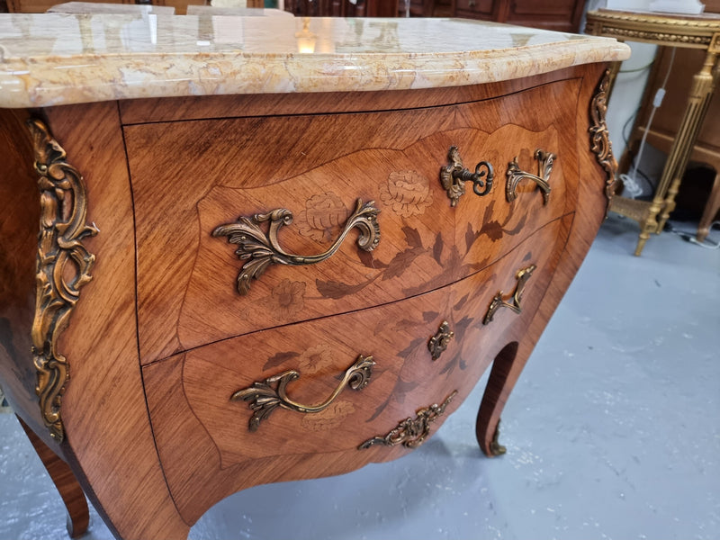 Fabulous French petite inlaid two drawer commode with ormolu mounts and lovely marble top. It is in good original detailed condition.