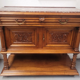 Stunning Henry II style French Walnut marble top buffet. It has a beautiful marble top and plenty of storage with two drawers, two doors with beautiful decorative carvings and an open shelf. It has been sourced from France and is in good original condition and has been detailed to a high standard.