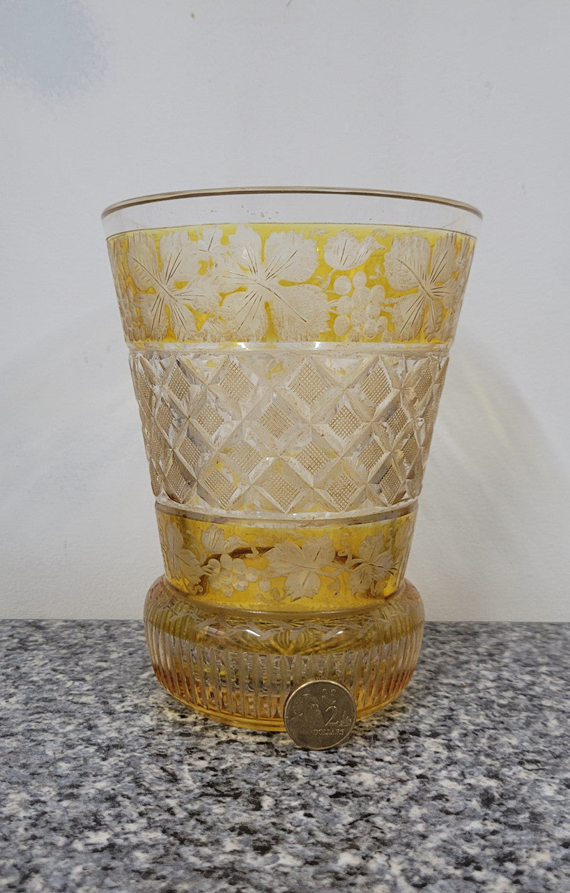 Antique Amber Bohemian acid etched and wheel engraved crystal vase. It has a stunning frieze of vine branches and a star cut base. It is in good original condition, please view photos as they help form part of the description.