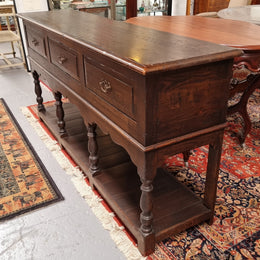 A very hard to find Vintage English kitchen dresser base of narrow proportions, sourced from France. In good original detailed condition.