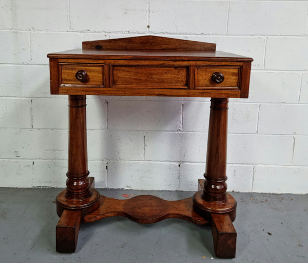 William IV style console table or could be used as a desk. It has two small drawers either side and is ideal for small areas like a unit or apartment. It is very sturdy and is in good original detailed condition.