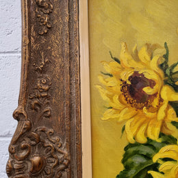 French signed oil on canvas depicting sunflowers in an attractive gilt frame. It is in good original detailed condition and has been sourced from France.