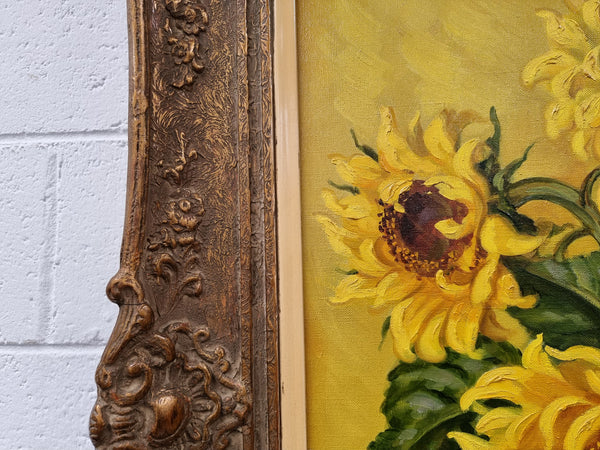 French signed oil on canvas depicting sunflowers in an attractive gilt frame. It is in good original detailed condition and has been sourced from France.