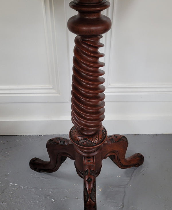 Rare early Victorian Irish Burr Walnut wine table. It has a beautiful carvings and a stunning burr walnut top, on a barley twist column and three shaped legs. It has been sourced locally and is in good original detailed condition. We also have a second table being sold separately which when together make a matched pair.